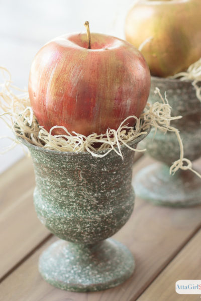 Add some sheen to your seasonal decor by making these metallic apples. Use creamy metallic waxes to transform faux fruit from the dollar store into pretty fall décor.