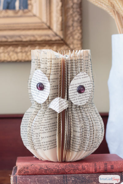 Wondering what to do with old books you don't want to read anymore? Learn how to upcycle them into book page art, like this adorable owl.