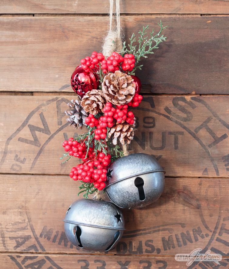 Christmas swag hanging on a vintage wooden stove cover
