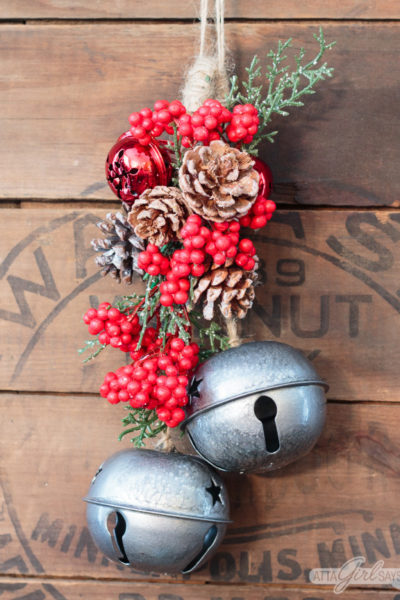 Whip up a jingle bells Christmas swag for your front door for just a few dollars using holiday decor and craft supplies from Dollar Tree. #ad #DollarTree