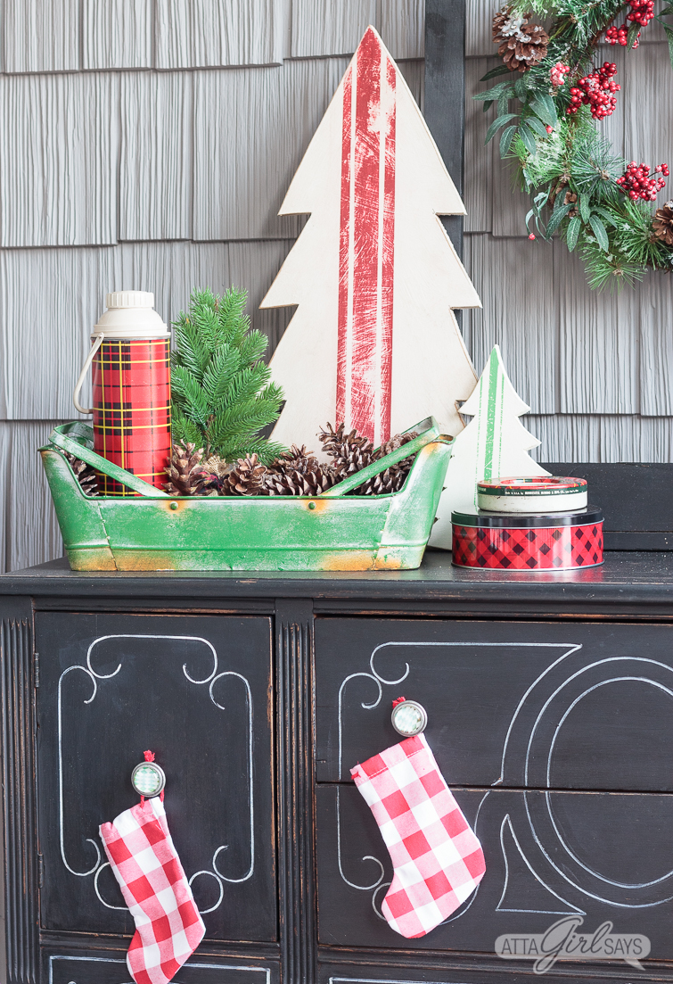 Tour this beautiful southern front porch decorated in vintage style for Christmas. You'll love the use of lanterns, beautiful ribbon and vintage thrifted finds in this stunning space. Which of these Christmas porch decor ideas would you use at your home?