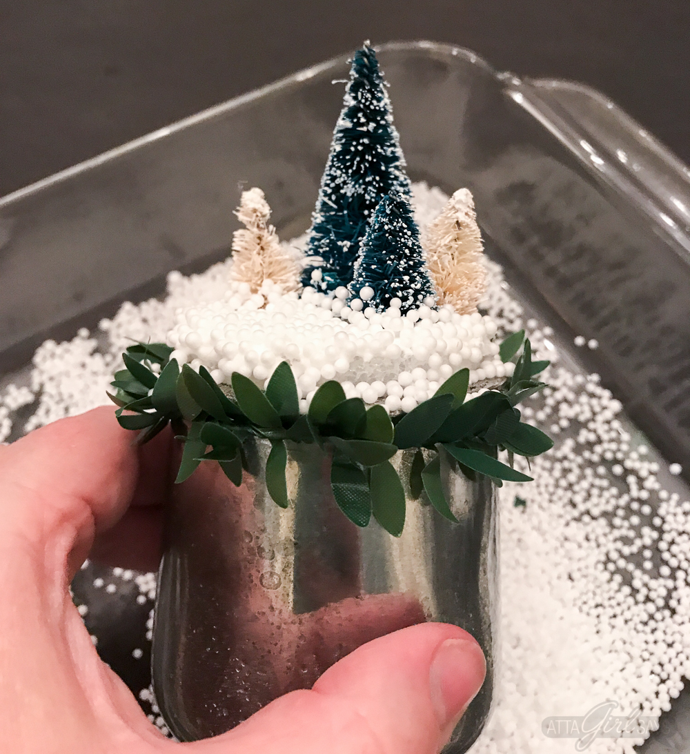 Turn glass yogurt jars into stunning sea glass and mercury glass votives. Add bottlebrush trees, greenery, tinsel and faux snow and use them as part of your Christmas decor. Click for step-by-step instructions and a complete supply list for making them. Plus check out the other ideas for repurposing jars and decorating with jars.