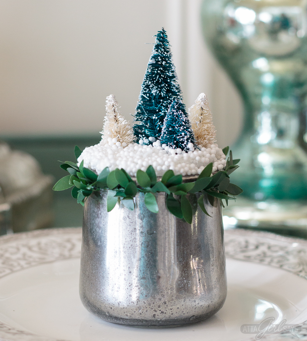 Turn glass yogurt jars into stunning sea glass and mercury glass votives. Add bottlebrush trees, greenery, tinsel and faux snow and use them as part of your Christmas decor. Click for step-by-step instructions and a complete supply list for making them. Plus check out the other ideas for repurposing jars and decorating with jars.
