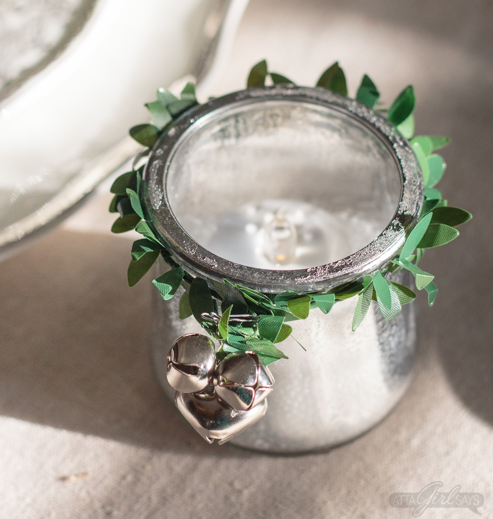 Turn glass yogurt jars into stunning sea glass and mercury glass votives. Add bottlebrush trees, greenery, tinsel and faux snow and use them as part of your Christmas decor. Click for step-by-step instructions and a complete supply list for making them. Plus check out the other ideas for repurposing jars and decorating with jars.