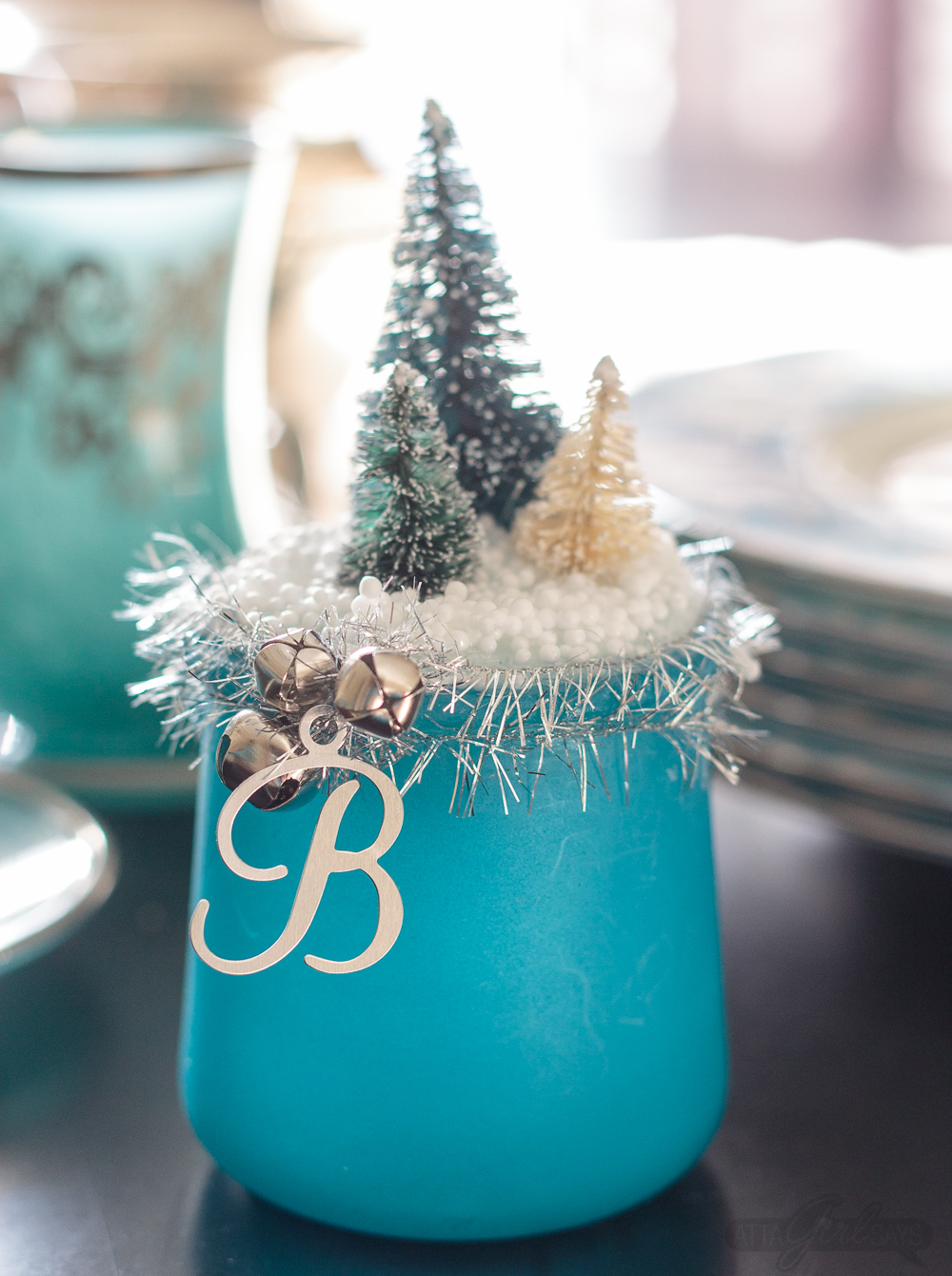 Turn glass yogurt jars into stunning sea glass and mercury glass votives. Add bottlebrush trees, greenery, tinsel and faux snow and use them as part of your Christmas decor. Click for step-by-step instructions and a complete supply list for making them. Plus check out the other ideas for repurposing jars and decorating with jars.
