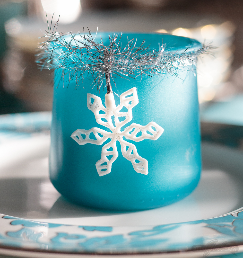 Turn glass yogurt jars into stunning sea glass and mercury glass votives. Add bottlebrush trees, greenery, tinsel and faux snow and use them as part of your Christmas decor. Click for step-by-step instructions and a complete supply list for making them. Plus check out the other ideas for repurposing jars and decorating with jars.