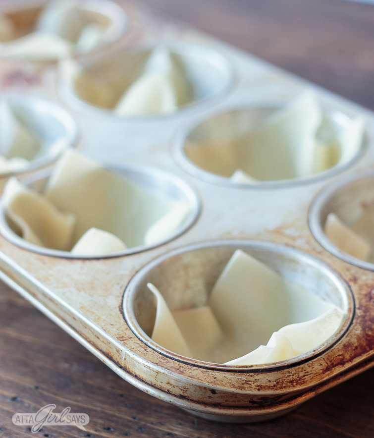 unbaked wonton cups in a muffin pan