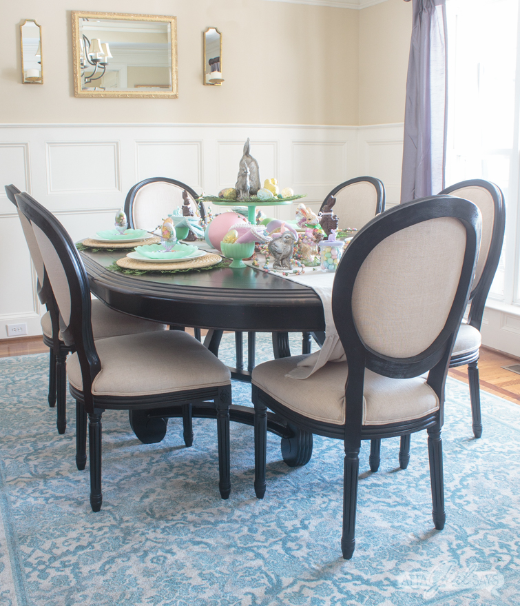 Let this pretty holiday tablescape, featuring pops of pastel and candy, inspire your own Easter table decor. I used chocolate molds, pastel candies, vintage Easter eggs, chocolate bunny figurines to create this sweet seasonal scene. #eastercandy #tablescape #eastertable #springtablescape #tabledecor