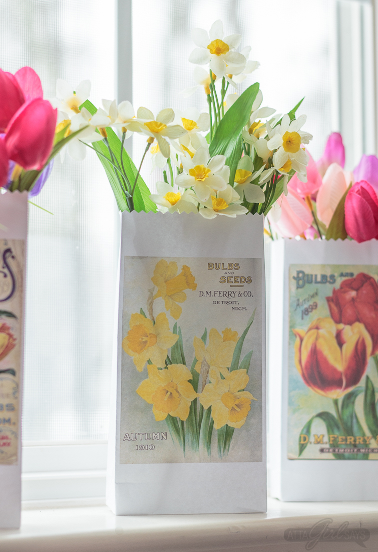 Print and make your own gardening themed party favor bags featuring artwork from vintage seed catalogs. This free collection includes lilies, tulips, daffodils, roses, hyacinths and other gorgeous spring flowers. Download all 22 designs, print them out using your &nbsp;home computer and learn step-by-step how to fold them into bags with this easy tutorial at AttaGirlSays.com. There's even a video demonstration. #springflowers #partyfavors #papercrafts #seedcatalogs #vintageflorals