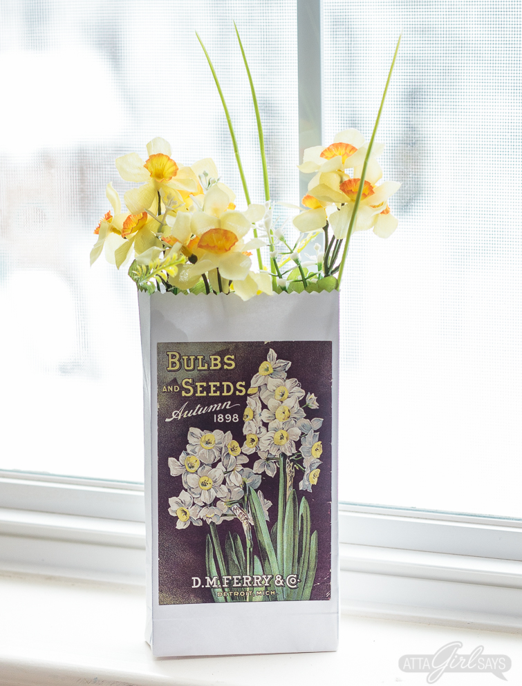 Print and make your own gardening themed party favor bags featuring artwork from vintage seed catalogs. This free collection includes lilies, tulips, daffodils, roses, hyacinths and other gorgeous spring flowers. Download all 22 designs, print them out using your &nbsp;home computer and learn step-by-step how to fold them into bags with this easy tutorial at AttaGirlSays.com. There's even a video demonstration. #springflowers #partyfavors #papercrafts #seedcatalogs #vintageflorals