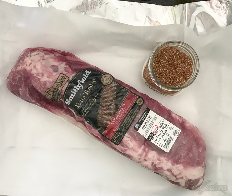 These Asian sweet & spicy grilled baby back ribs are going to be the star of your next cookout! Seasoned with a delicious homemade spice rub and slow cooked on the grill until they're fall-off-the-bone tender, the ribs are finished with a maple chili garlic sauce. You'll feel like a champion pitmaster every time you serve these! #ad #GetGrillingAmerica #ribs #grilledribs