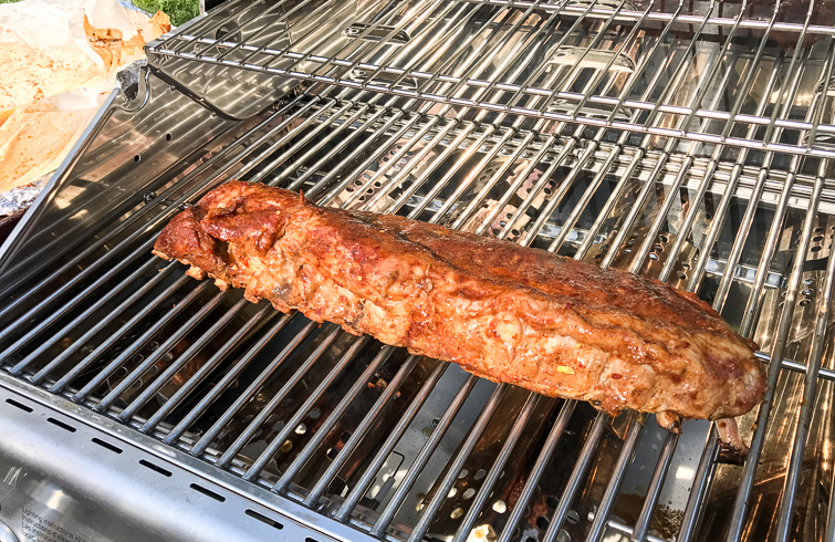 These Asian sweet & spicy grilled baby back ribs are going to be the star of your next cookout! Seasoned with a delicious homemade spice rub and slow cooked on the grill until they're fall-off-the-bone tender, the ribs are finished with a maple chili garlic sauce. You'll feel like a champion pitmaster every time you serve these! #ad #GetGrillingAmerica #ribs #grilledribs