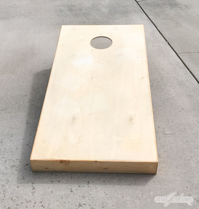 Transform plain cornhole boards into custom tailgate games with paint or stain and FrogTape. #ad #cornhole #backyardgames