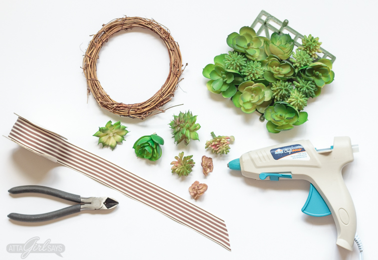 Learn how to make a realistic looking DIY faux succulent wreath for your summer decorating. Hang them on the backs of your dining chairs, on lampshades, on cabinet doors or anywhere else you like. They're great for summer and add a nice natural touch to your home decor. #succulents #succulentwreath #tablescape #decoratingideas #decoratingwithplants