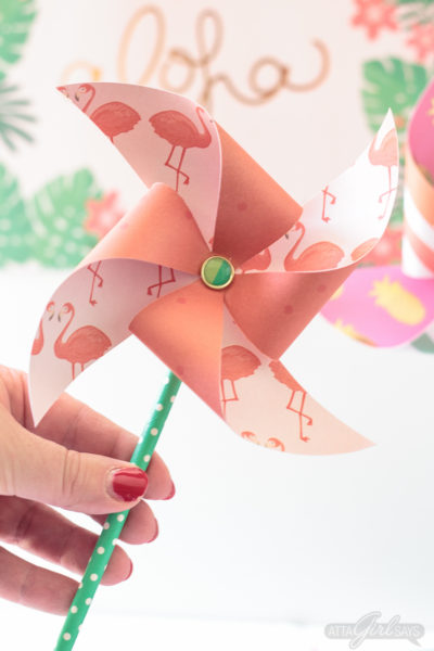 woman holding a paper pinwheel