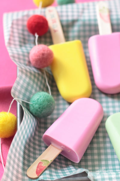 Kids will go wild for this fruity-scented popsicle-shaped easy homemade soap. You can make a batch in just 10 minutes using your microwave! These popsicle soaps are great party favors or a summertime craft with kids. #kidscrafts #homemadesoap #soapmaking #popsicles #summercrafts