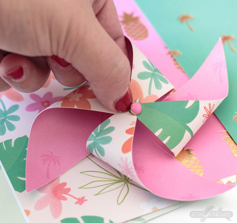 Need to add a festive touch to any occasion? Grab some pretty patterned scrapbook paper and I'll show you how to make pinwheels. They're so easy to make, even kids can help! Use your homemade pinwheels for party banners, cupcake toppers, centerpieces and more. #papercrafts #pinwheels #scrapbookpaper
