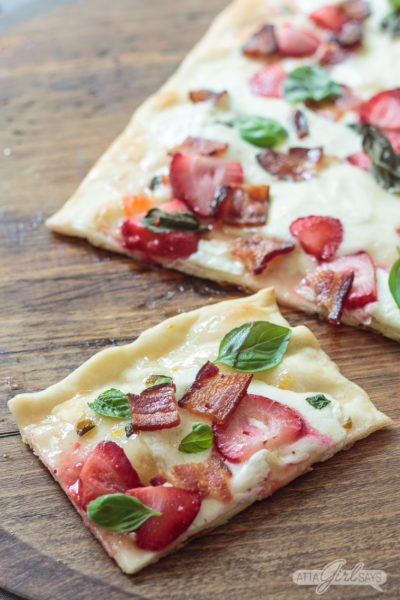 strawberry bacon flatbread pizza on a wooden pizza peel