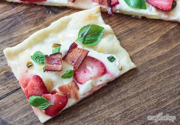 rectangular slice of strawberry bacon flatbread pizza with basil