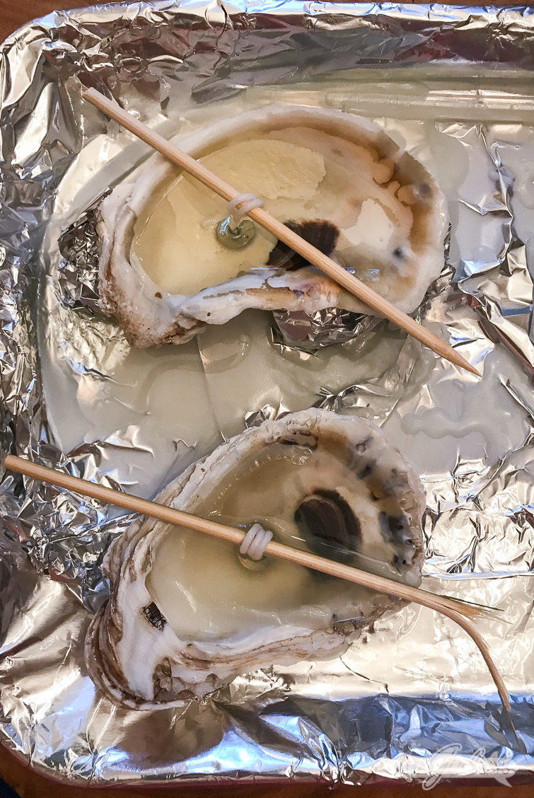 Add your favorite beach fragrance to these DIY oyster shell candles. How pretty would these be on the tables at a beach wedding or a romantic seaside dinner? #beachcrafts #seashellcrafts #oystershells #seashells #seashell #beachwedding #coastal #destinationwedding #diywedding #weddingdecor Oyster shells candles being made