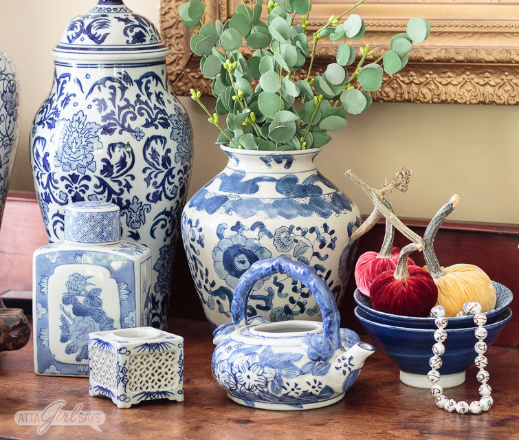 blue and white lamps and ginger jars on a sideboard