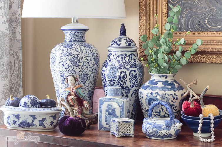 blue and white lamps and ginger jars on a sideboard