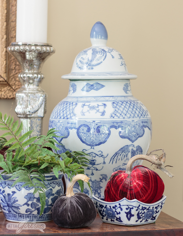 blue and white ginger jar, flower pot and cachepot on an antique empire sideboard decorated for fall