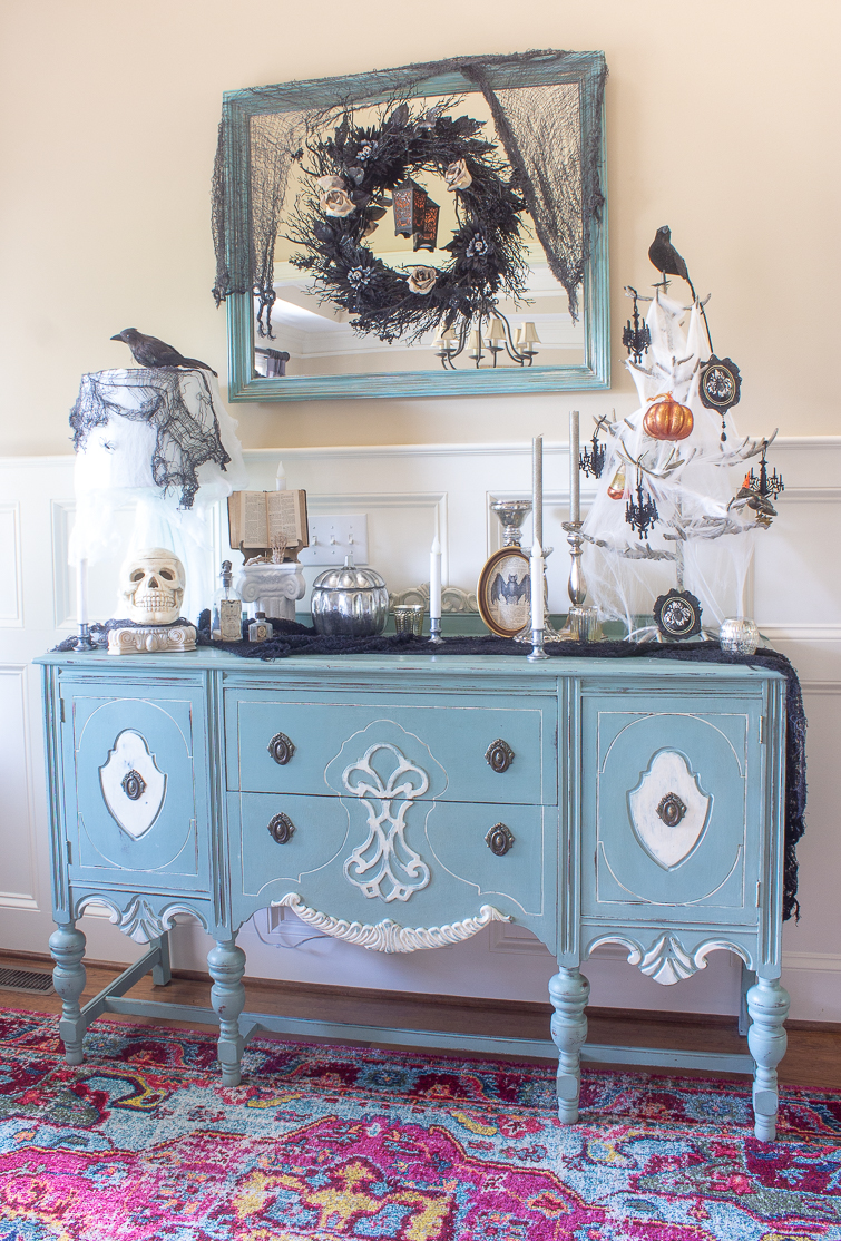 aqua blue vintage painted buffet decorated with gothic Halloween decorations