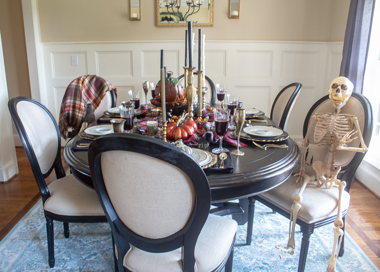 black dining table set with Halloween table decorations