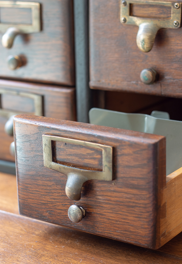 closeup of a wooden card catalog drawer