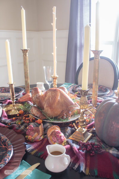 Thanksgiving table with turkey on a platter