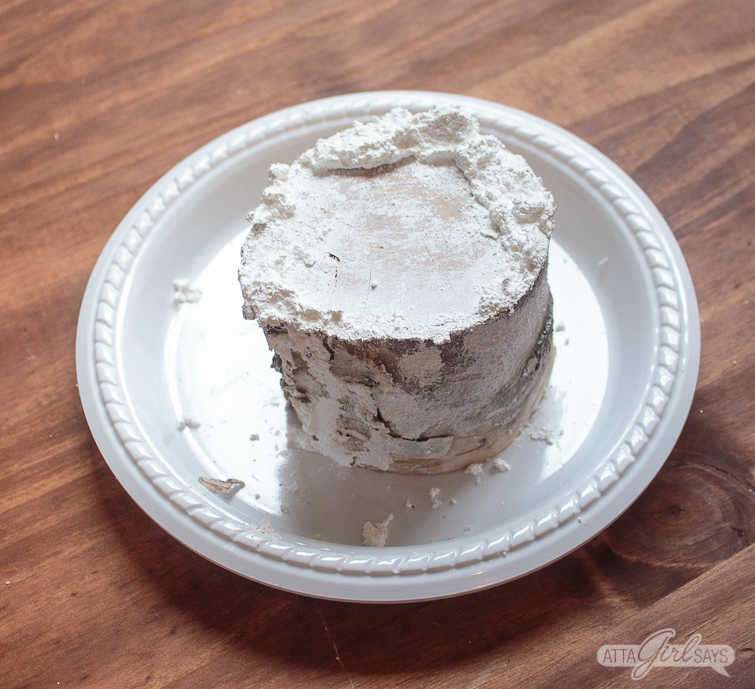 applying DecoArt Snow-Tex to a birch log 