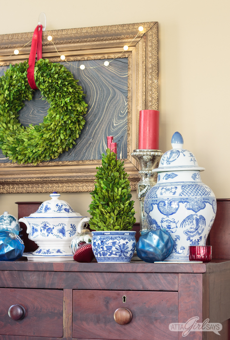 empire style buffet decorated with blue and white choinoiserie pottery for Christmas