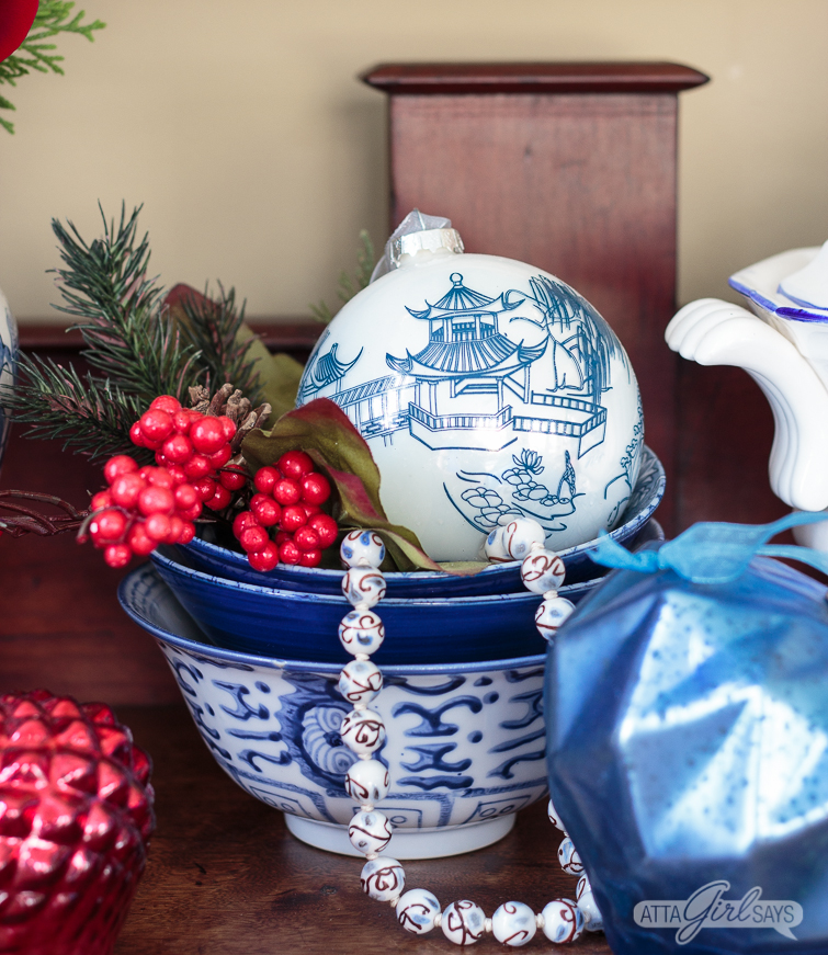 empire style buffet decorated with blue and white choinoiserie pottery for Christmas