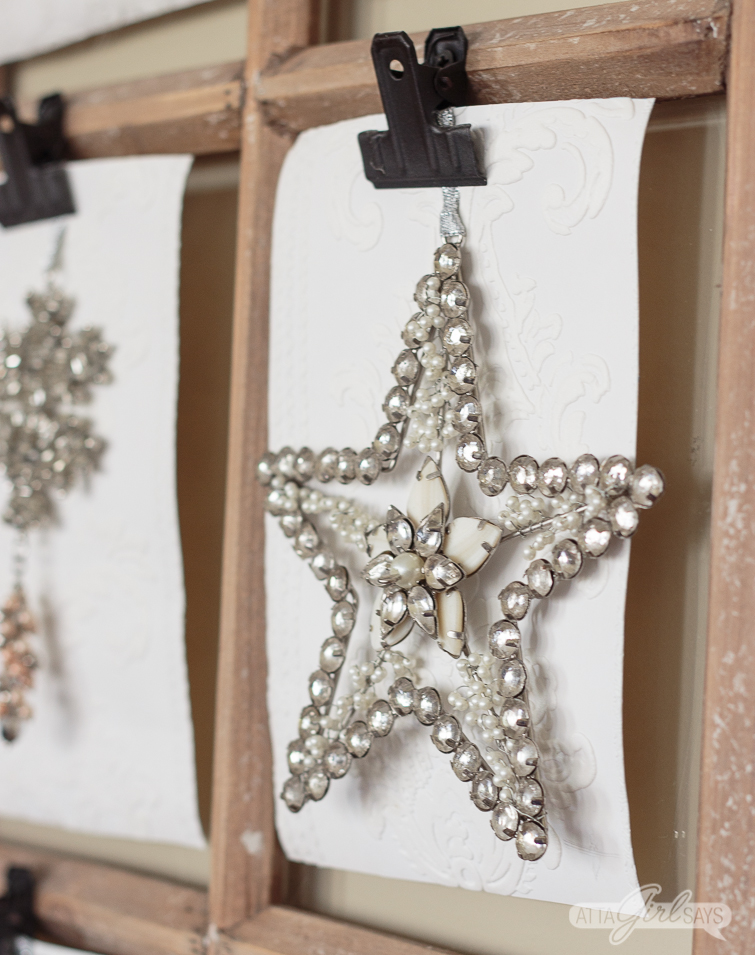 jewel star ornament hanging on a window pane