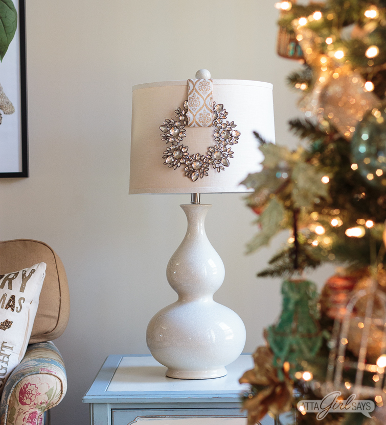pink, green and gold ornaments on a Christmas tree decorated with gold ribbon