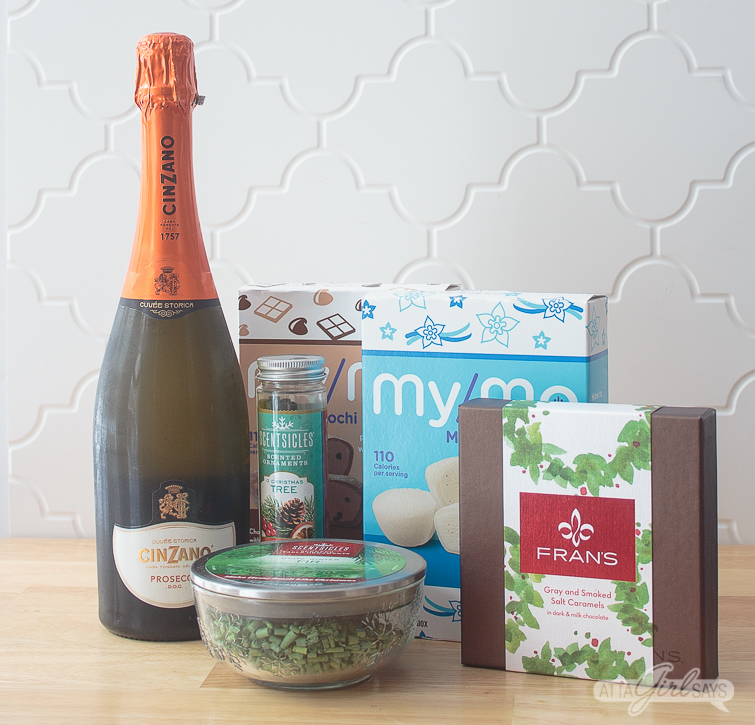 prosecco, chocolates, mochi ice cream and Scentsicles on a kitchen counter