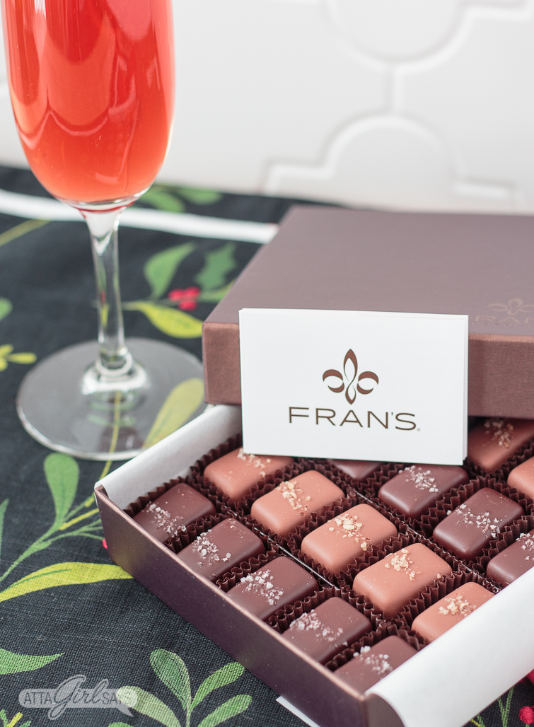 pomegranate mimosa and a box of chocolate salted caramels