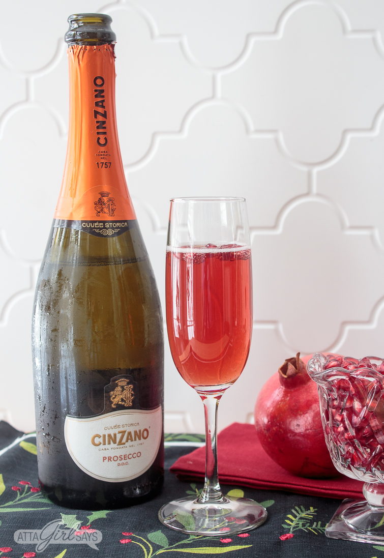 pomegranate mimosa and a bottle of Cinzano prosecco