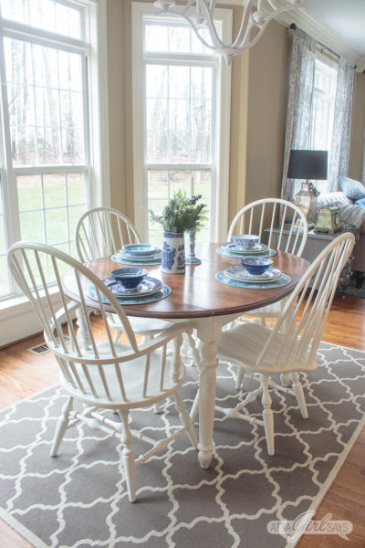 farmhouse style stained kitchen table with white legs and painted Windsor dining chairs
