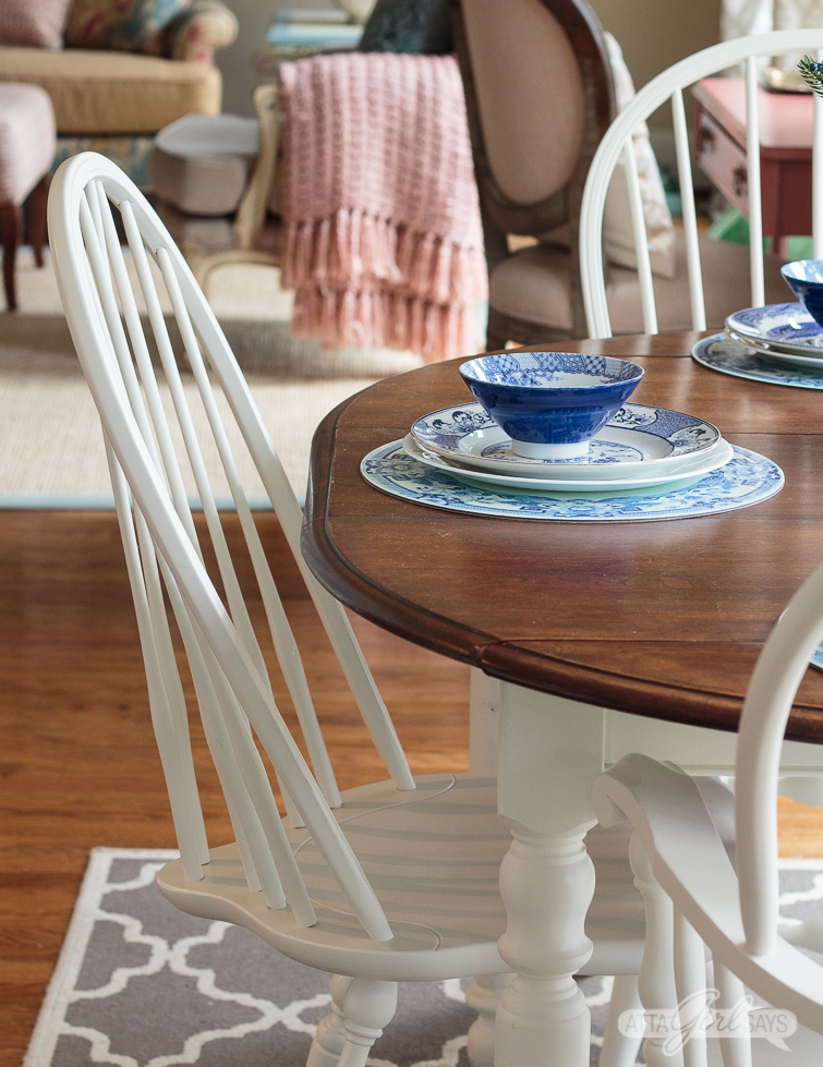 white painted Windsor dining chair at a two-tone kitchen table