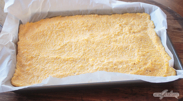 leftover grits spread on a parchment lined baking sheet