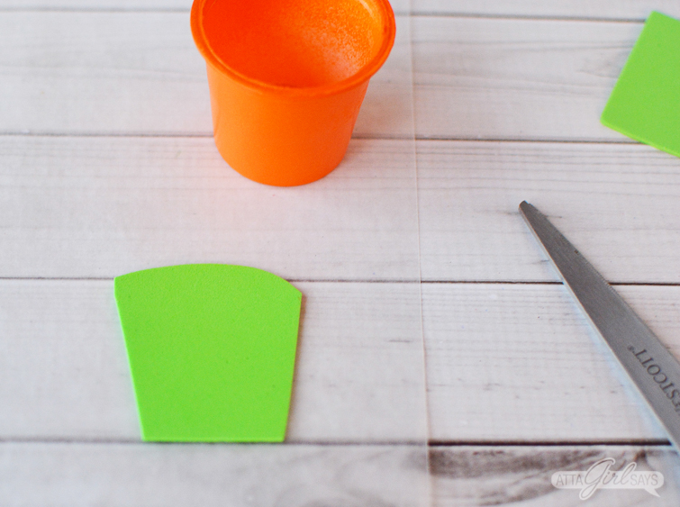 Use green foam to make grass for carrot Easter treat cups