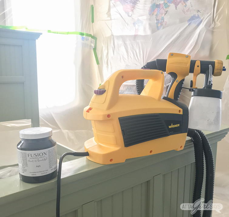 Wagner paint sprayer on a green bed frame