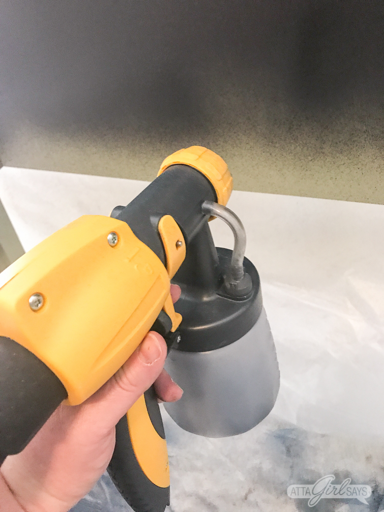 using a Wagner FLEXiO sprayer to paint a bed