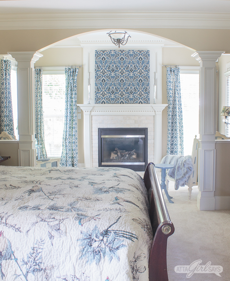 sitting room with a fireplace with blue artwork over the fireplace