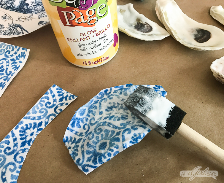 brushing decoupage medium on chinoiserie oyster shells