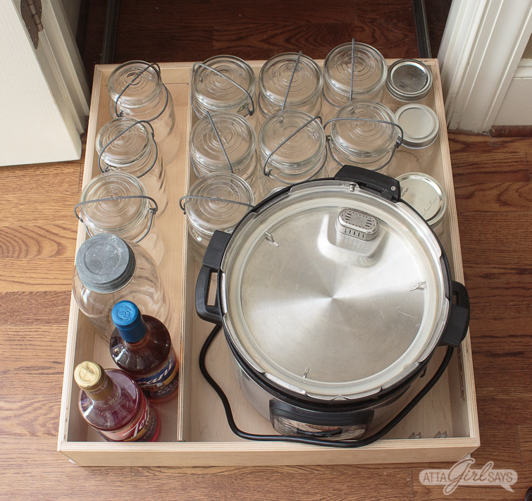 mason jars and an InstantPot on a slide-out pantry shelf