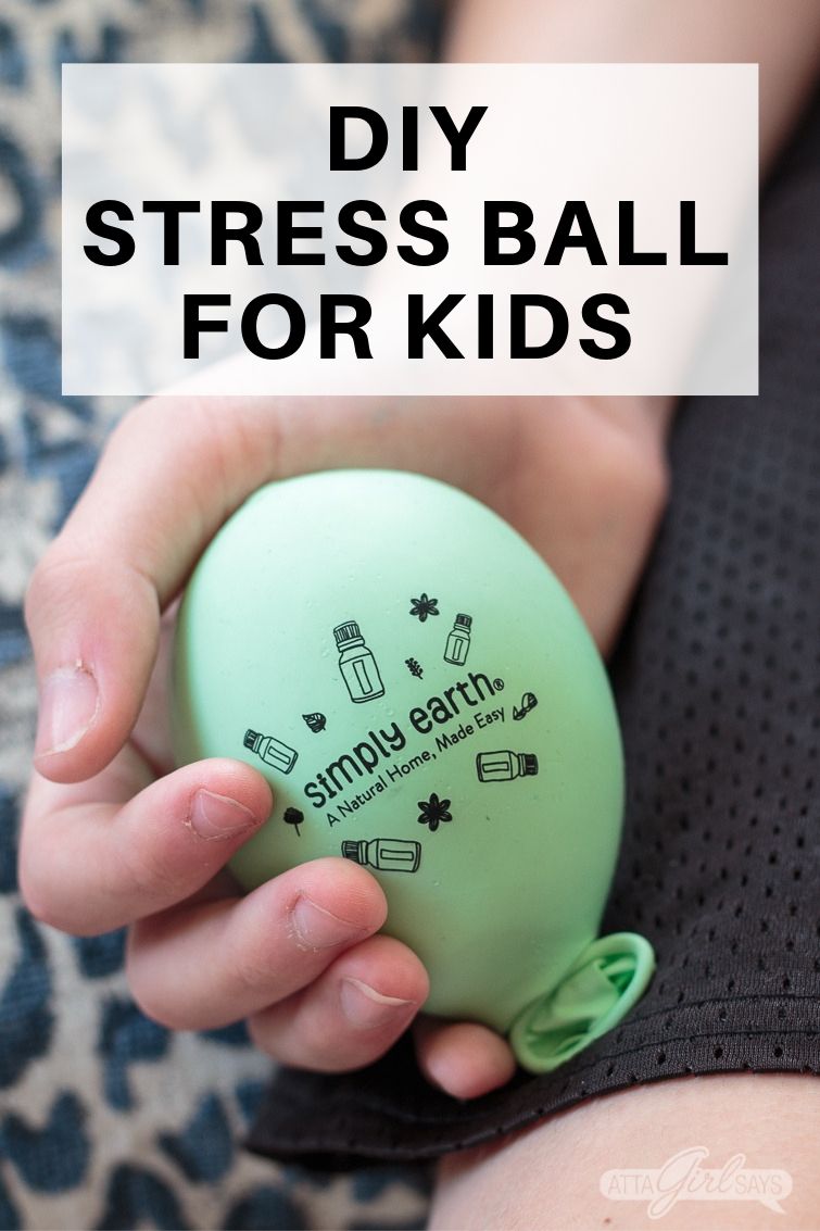 boy holding a DIY stress ball for kids made from a balloon