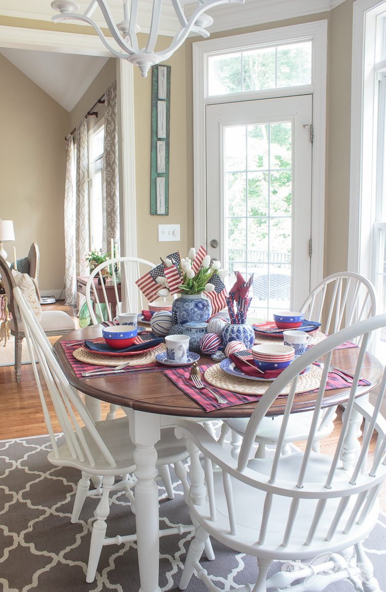 patriotic tablescape with blue and white china and ginger jars mixed with plaid